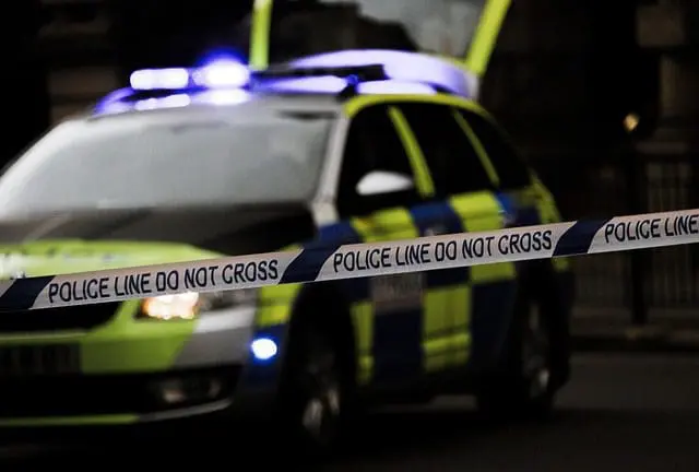 police vehicle and barrier tape in emergency incident