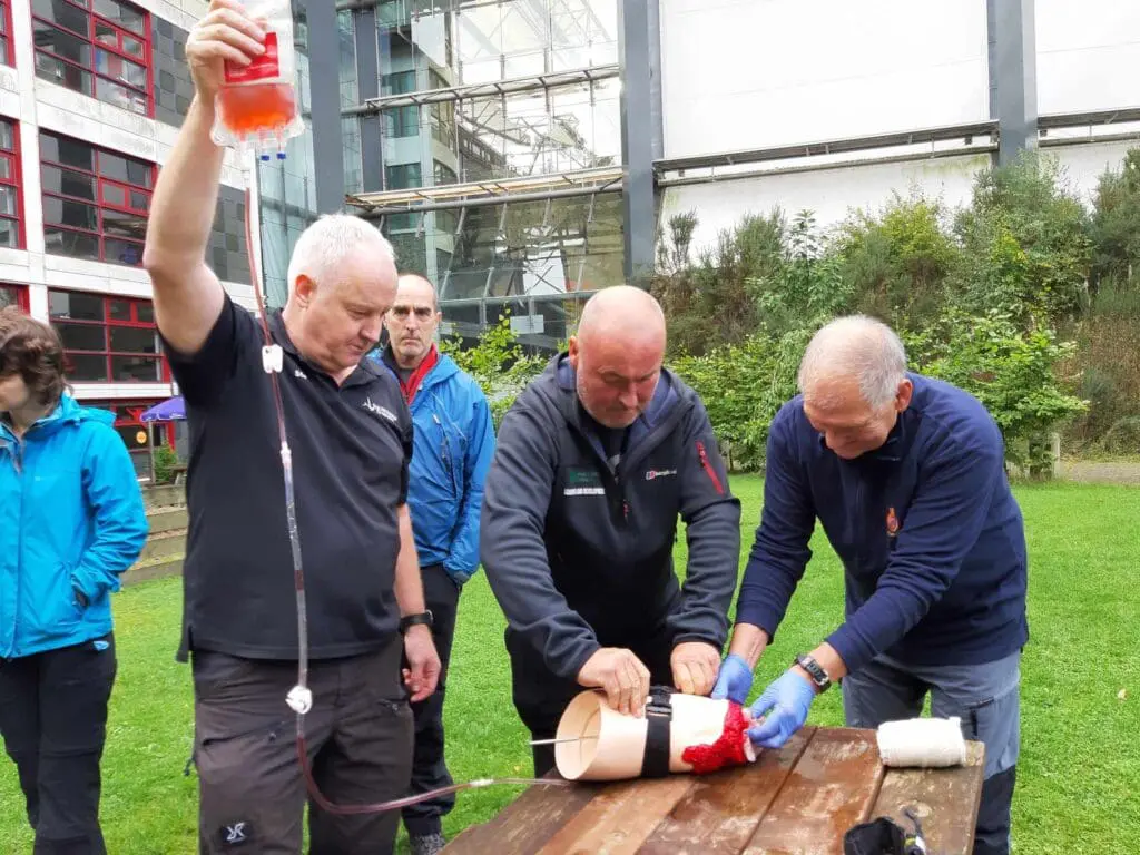 A catastrophic bleeding exercise using bottled fluid and a tourniquet