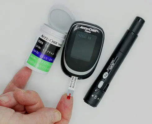 A diabetes glucose test kit in use