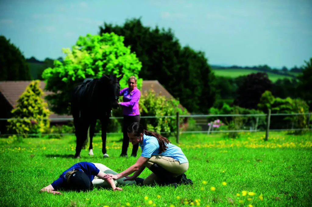 First aider attending a horse riding incident