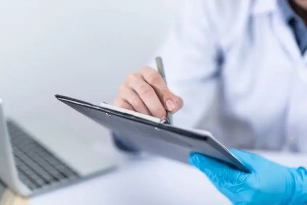 A medic taking notes on a clipboard