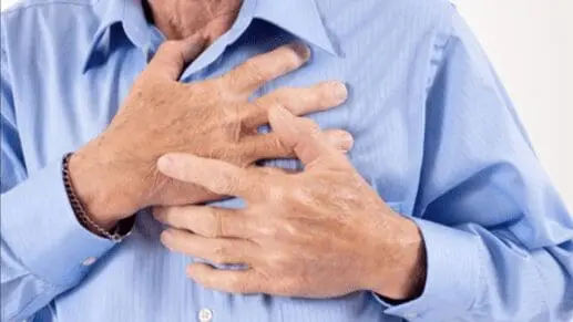 A man gripping his chest