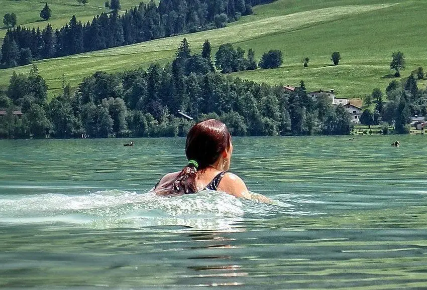 Woman swimming in a loch