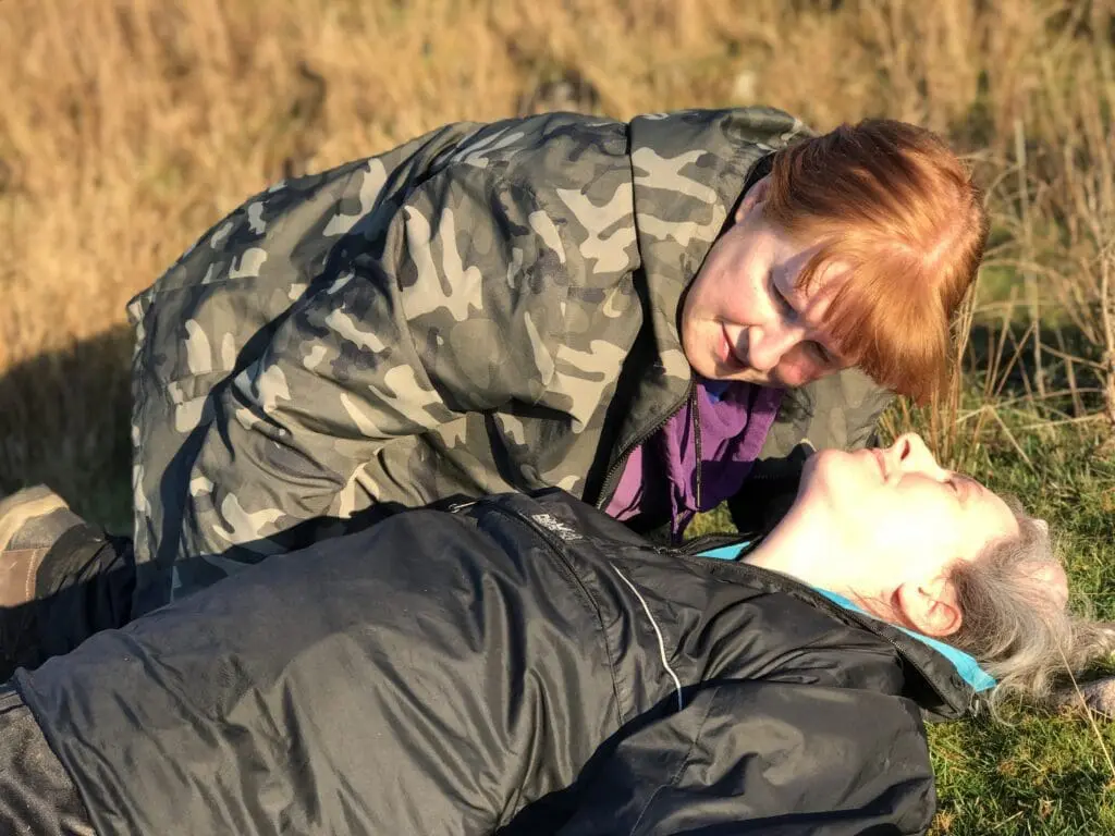 Checking the breathing of a casualty