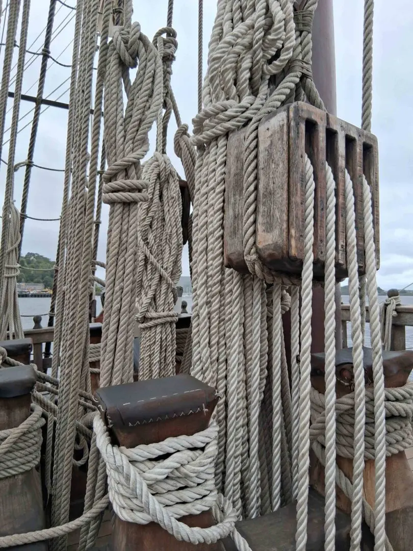 A variety of ropes gathered neatly on and old ship