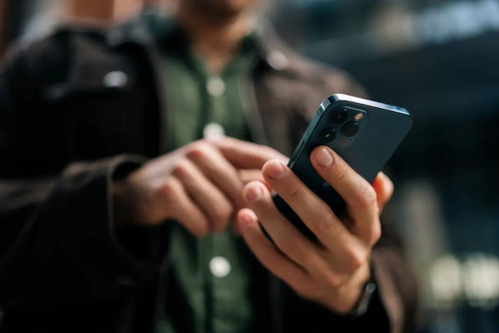 Hands using a mobile phone