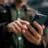 Hands using a mobile phone