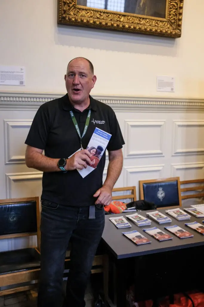 Cory Jones of First Aid Training Co-operative mans his information desk at the RGS Explore conference.
