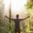 AI image of a man in a forest with arms outstretched