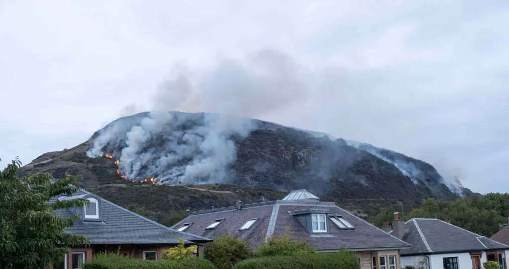 A wildfire on Arthur's Seat in Edinburgh with houses inthe foreground