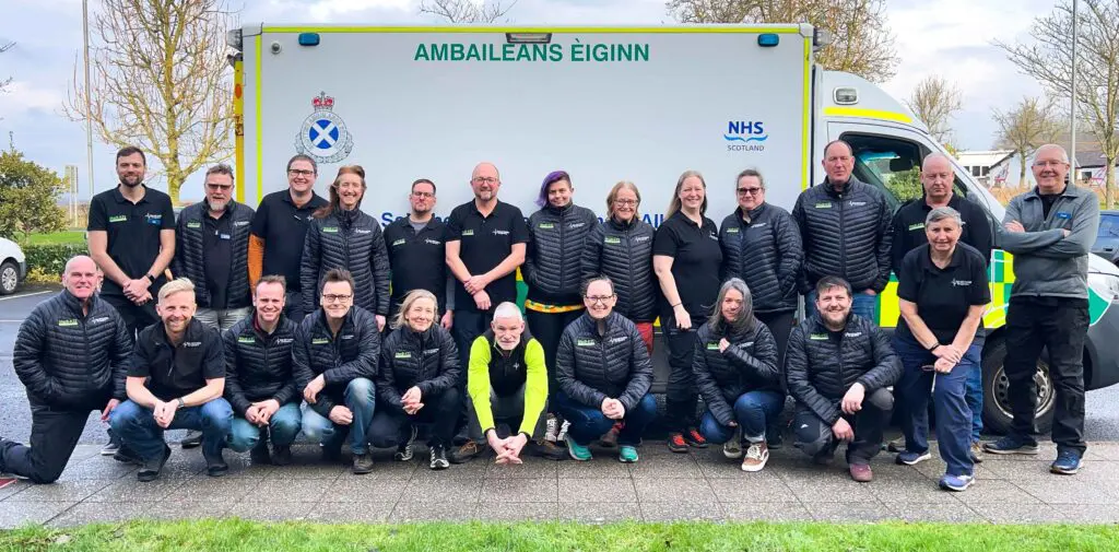 FATC team photo in front of an ambulance