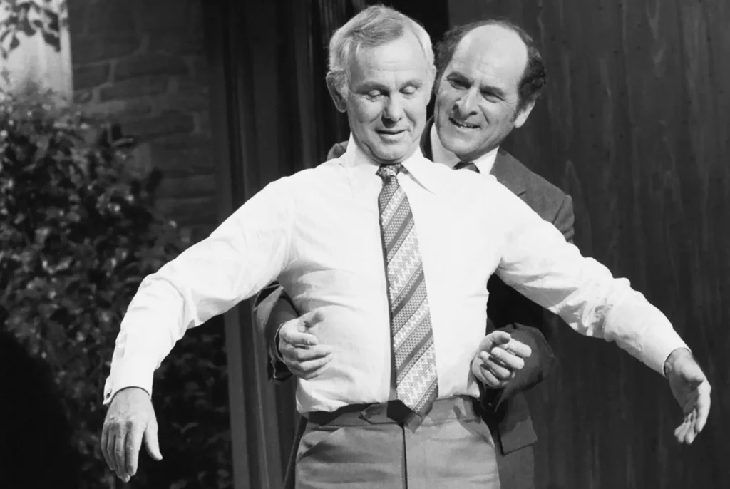 Dr Heimlich demonstrating on Jonny Carson