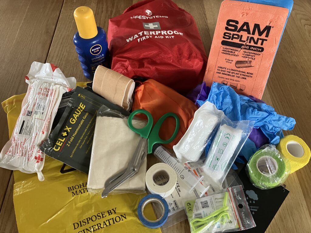 An outdoor first aid kit with contents showing